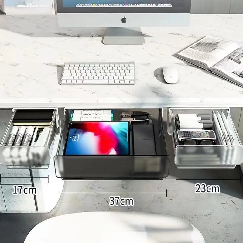 Open view inside the clear desk storage drawer showing neat organization of memo pads and pens.